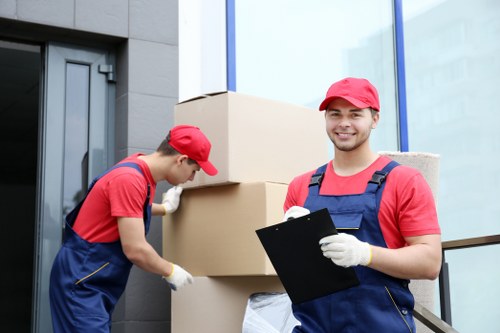 Removal team planning a move in Coneyhall with packed boxes