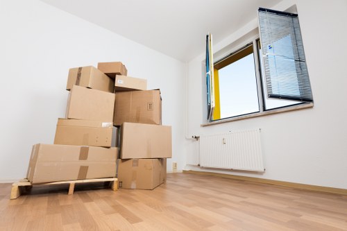 Professional moving team handling furniture during a Coneyhall house move